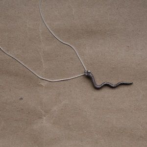 Silver snake necklace with rhinestone eyes .925